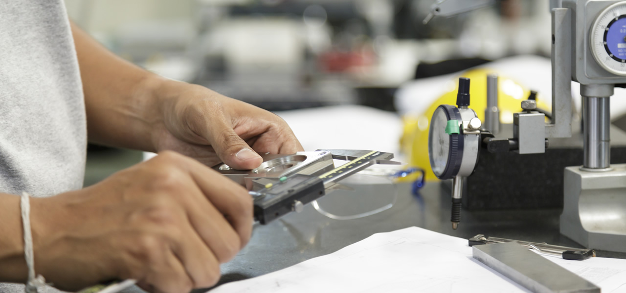 Technician calibrating clinical medical equipment